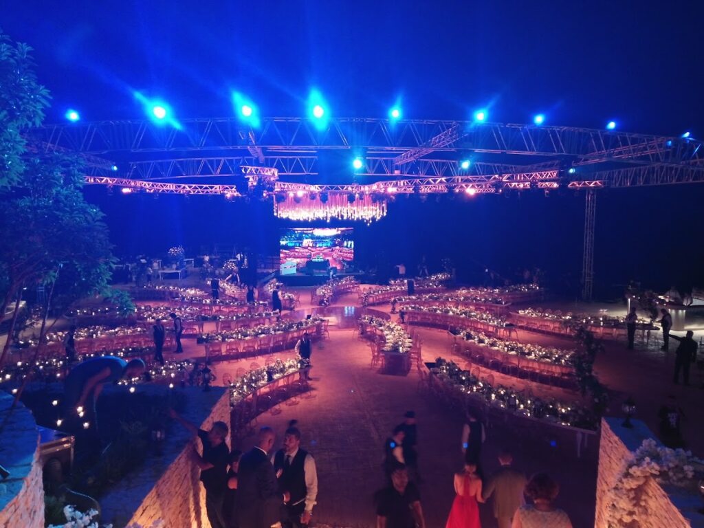 a large outdoor event with tables and chairs