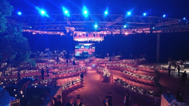 a large outdoor event with tables and chairs