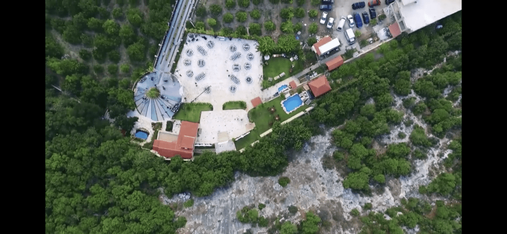 an aerial view of a building and trees