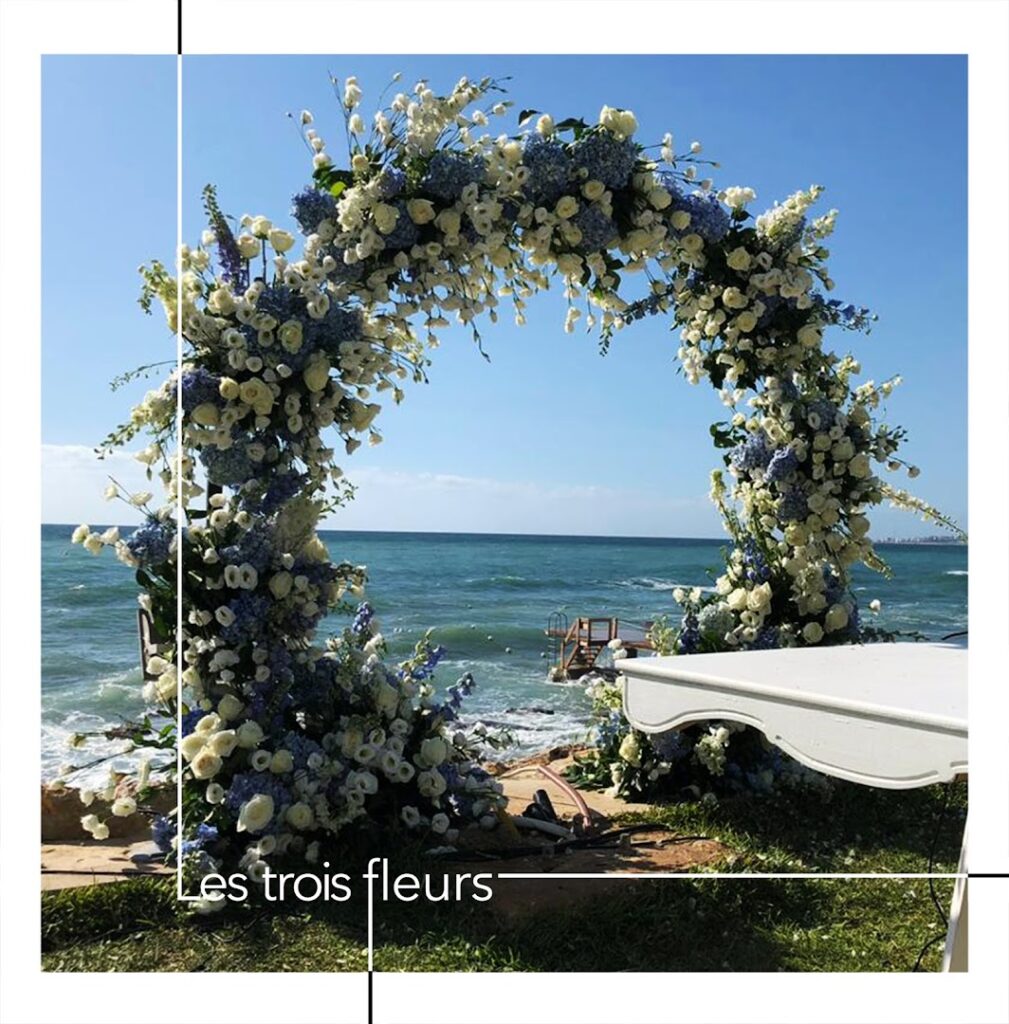 a flower arch on the beach