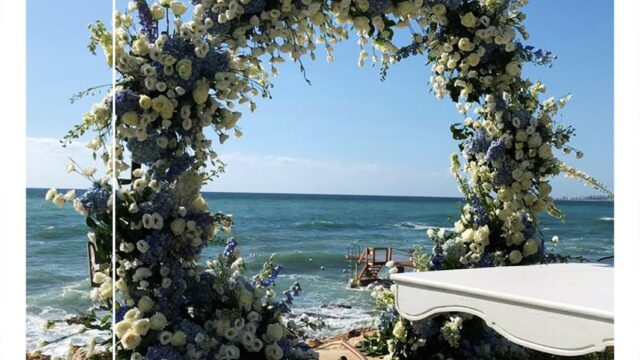 a flower arch on the beach