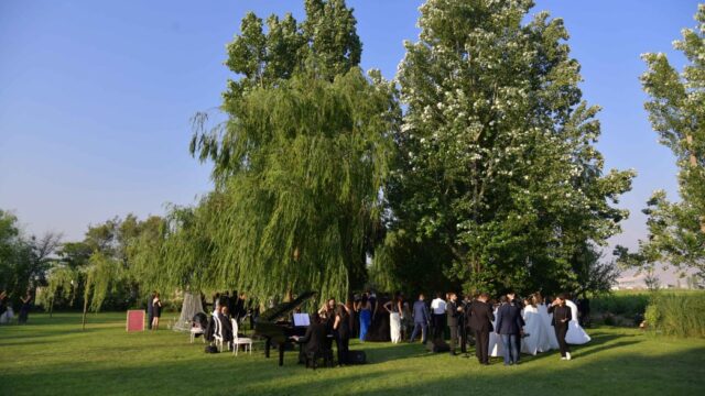 a group of people in formal attire outside