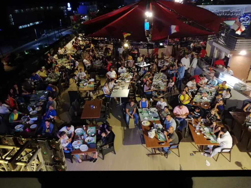 a group of people sitting at tables