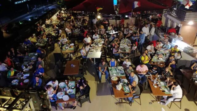 a group of people sitting at tables