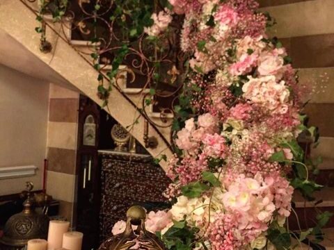 a spiral staircase with flowers and candles