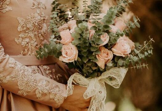 a person holding a bouquet of flowers