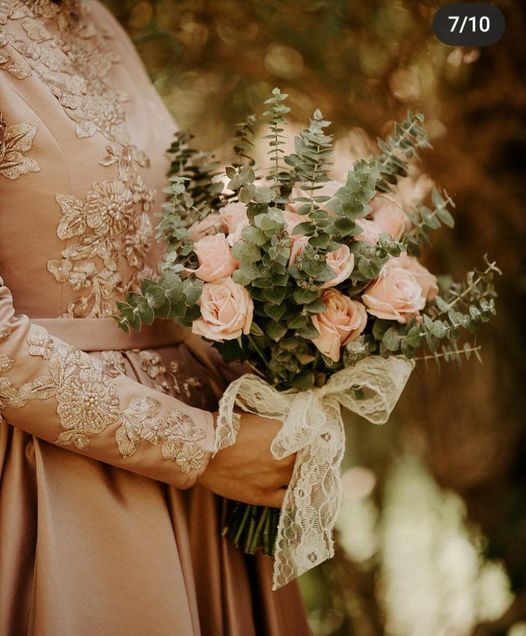 a person holding a bouquet of flowers