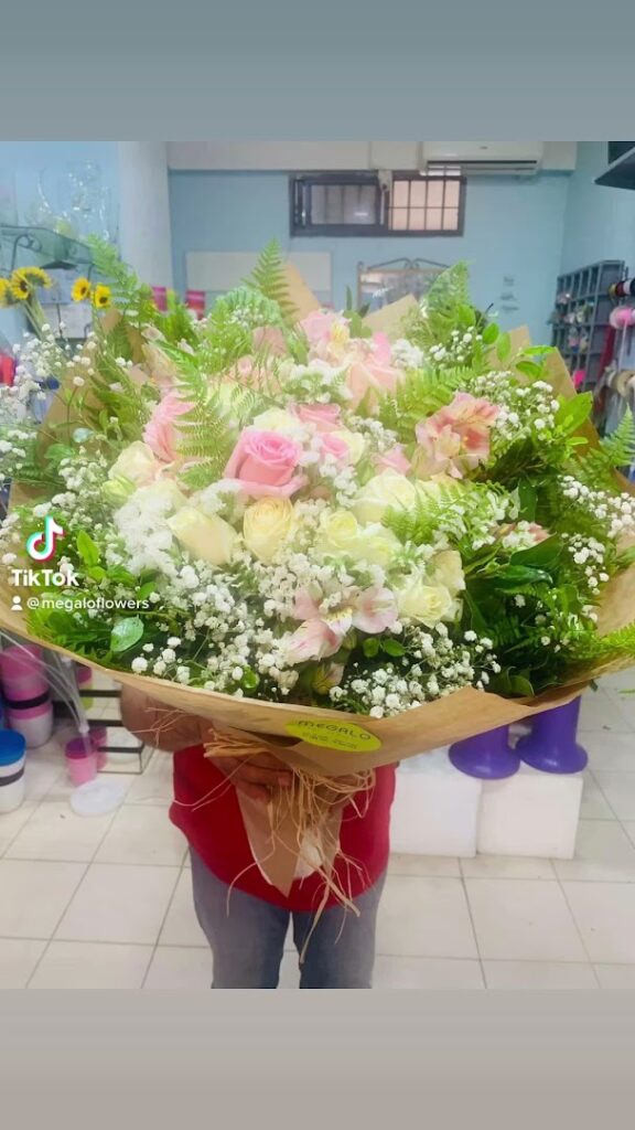 a person holding a bouquet of flowers