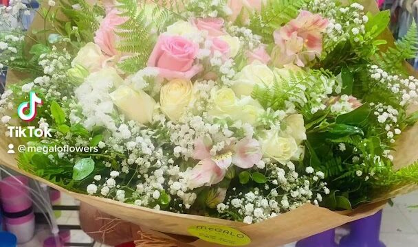 a person holding a bouquet of flowers