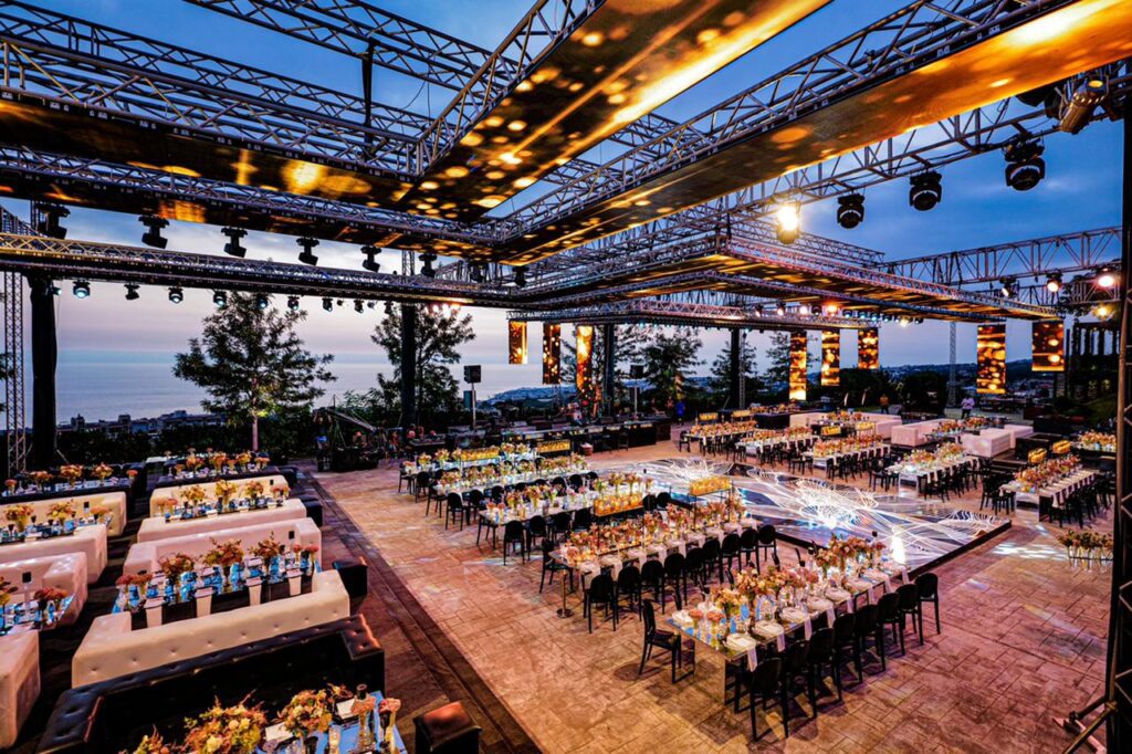 a large outdoor event with tables and chairs