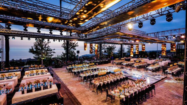 a large outdoor event with tables and chairs