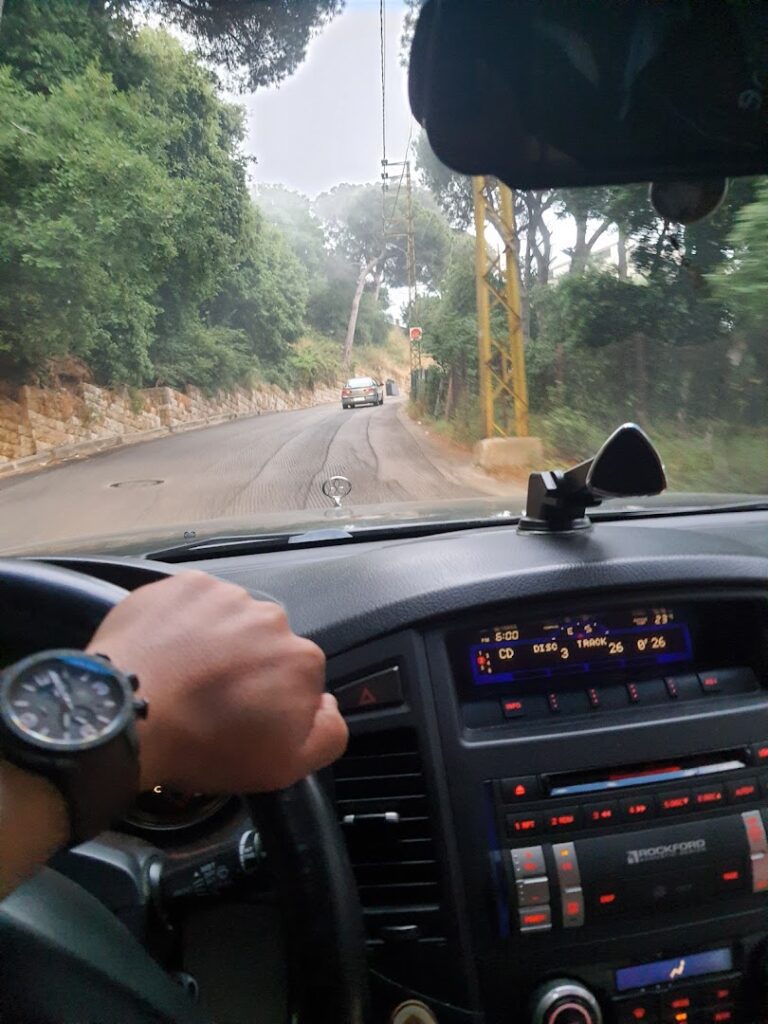 a person driving a car on a road