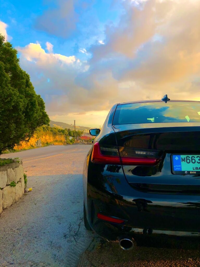 a black car parked on a road