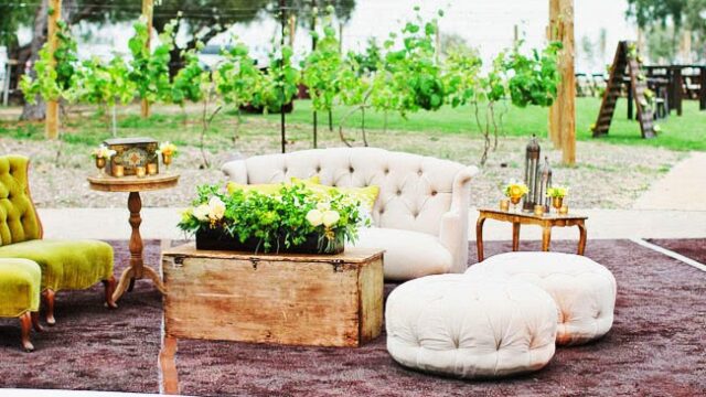 a couch and stools on a rug