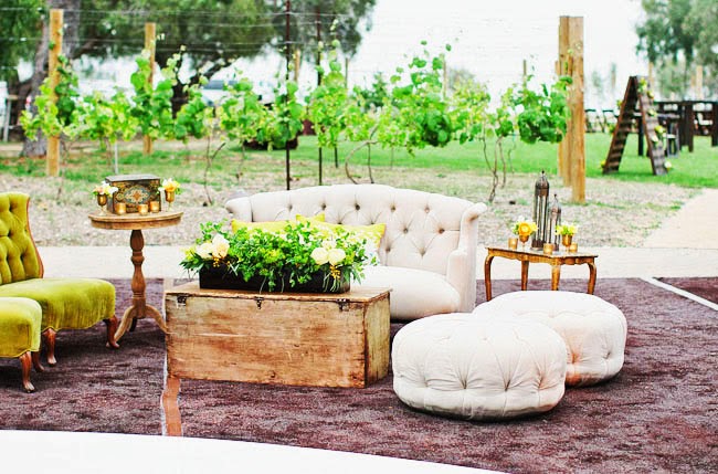 a couch and stools on a rug