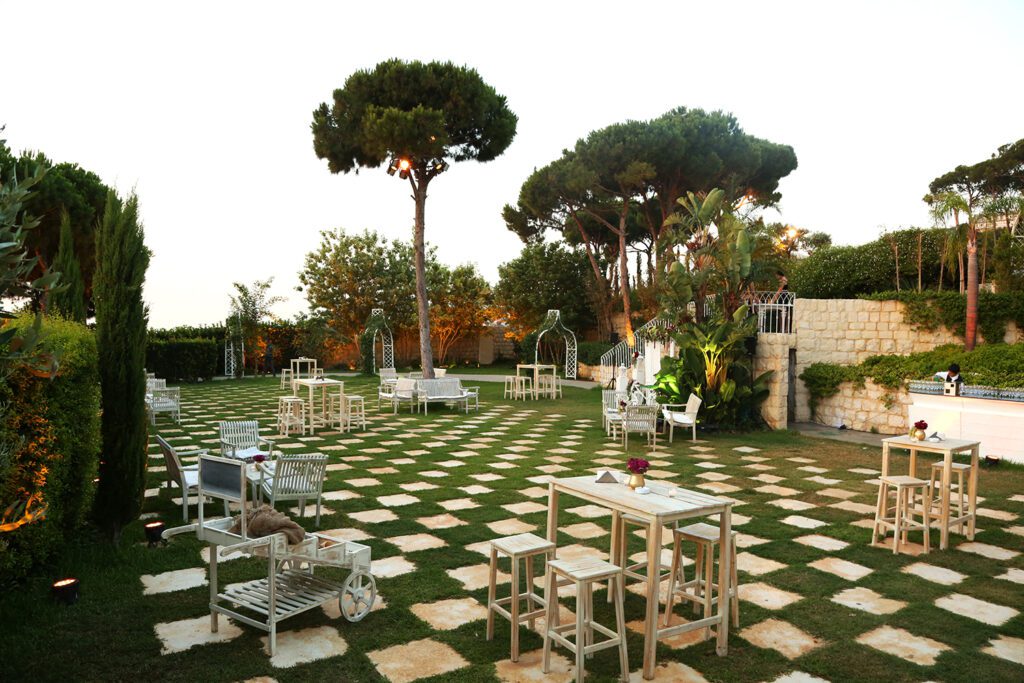 a large checkered lawn with tables and chairs