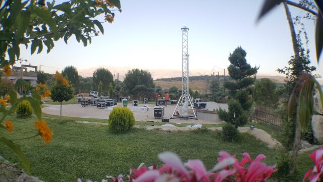 a stage set with a tower in the background