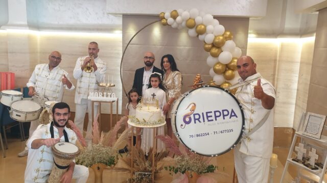 a group of people in white outfits