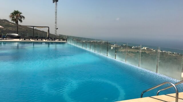 a pool with a railing over it