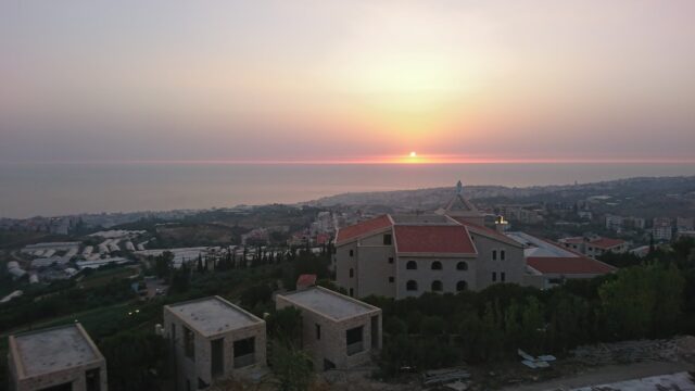 a sunset over a city