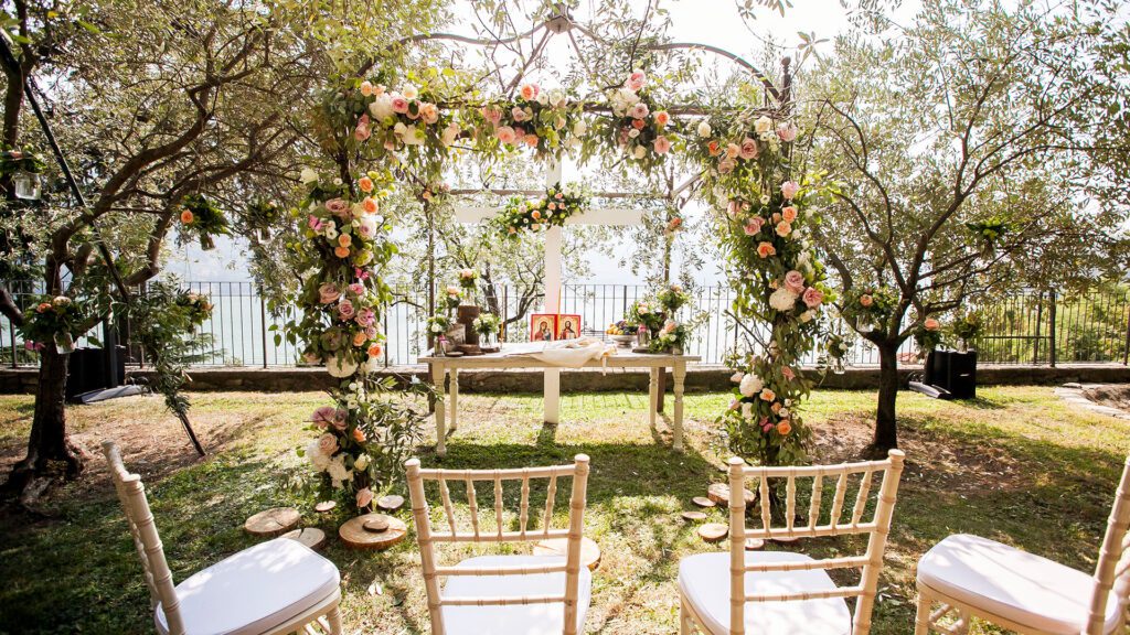 a wedding ceremony with chairs and flowers