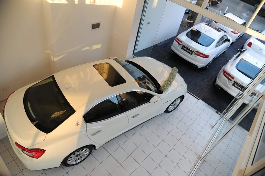 a white car parked in a showroom