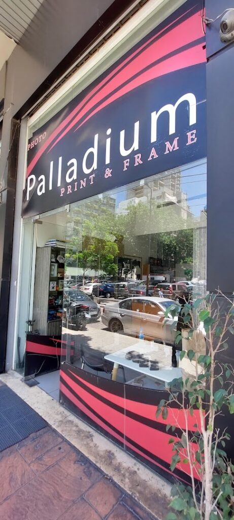 "A store front with a sign, window, and the keywords 'Photo paladium'."