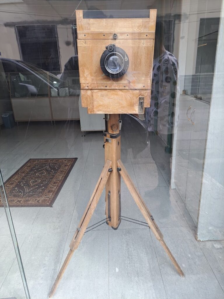 a wooden camera on a tripod