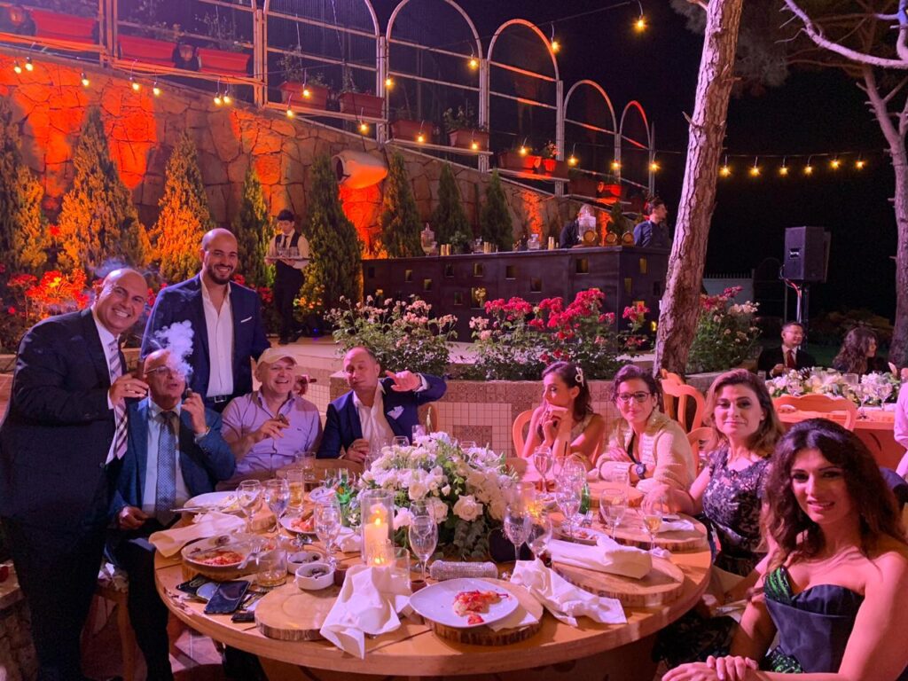 a group of people sitting around a table