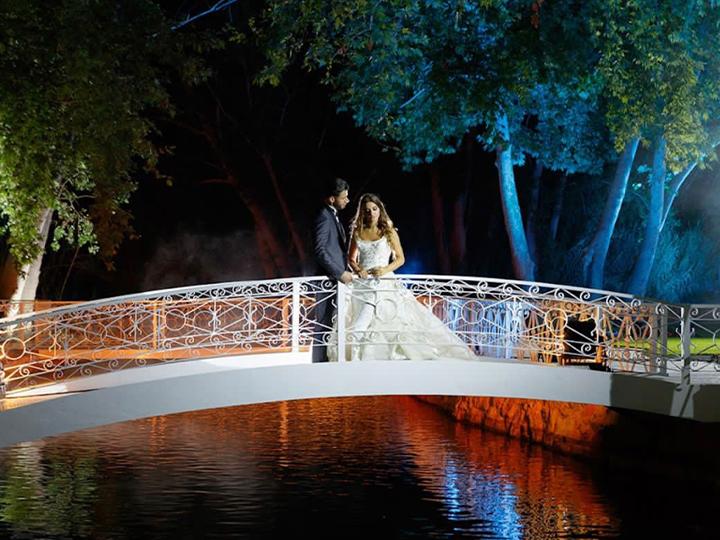 a man and woman standing on a bridge