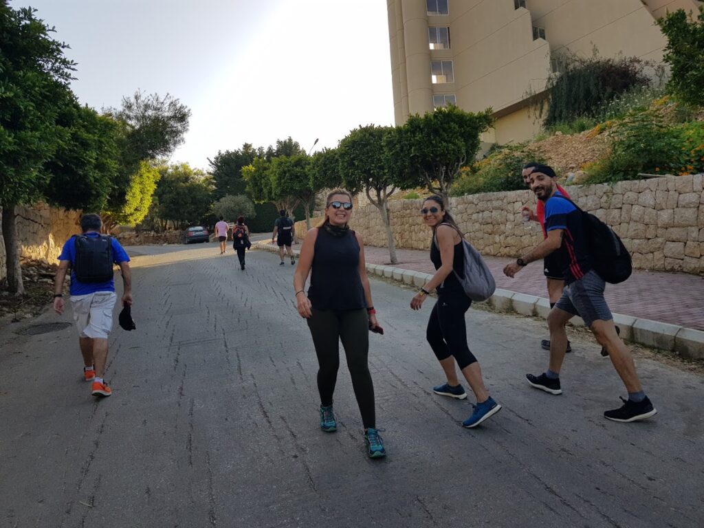 a group of people walking on a street