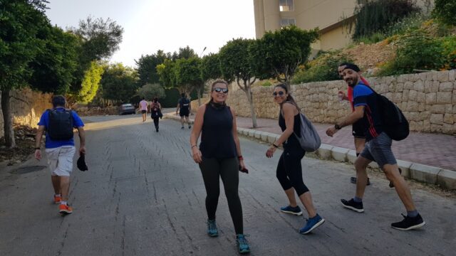 a group of people walking on a street