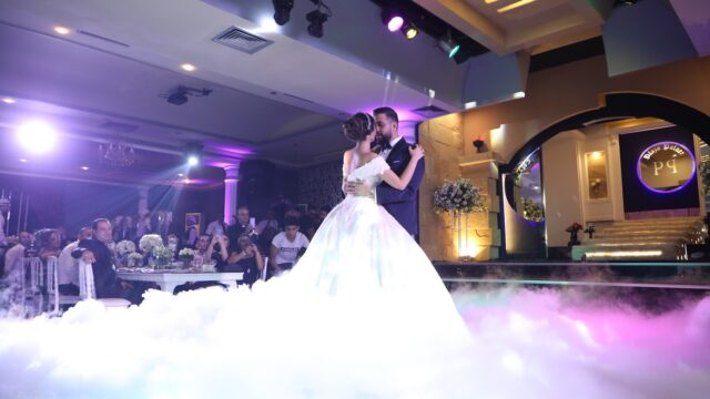 a man and woman dancing on a stage