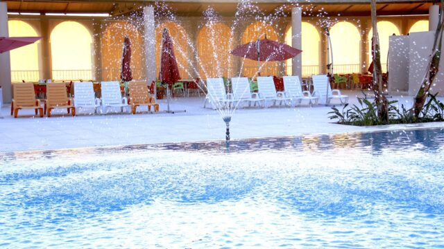 a pool with a fountain in it