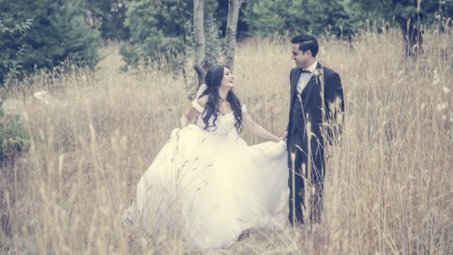 a man and woman in a field