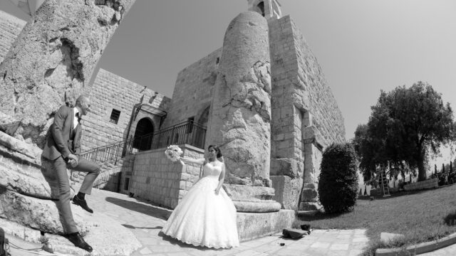 a bride and groom posing for a picture