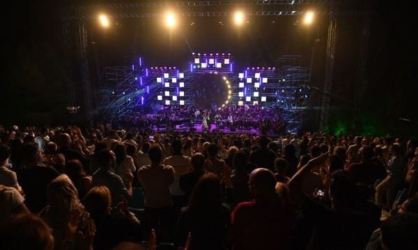 a crowd of people watching a concert