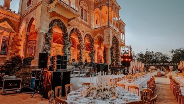 a large building with tables and chairs