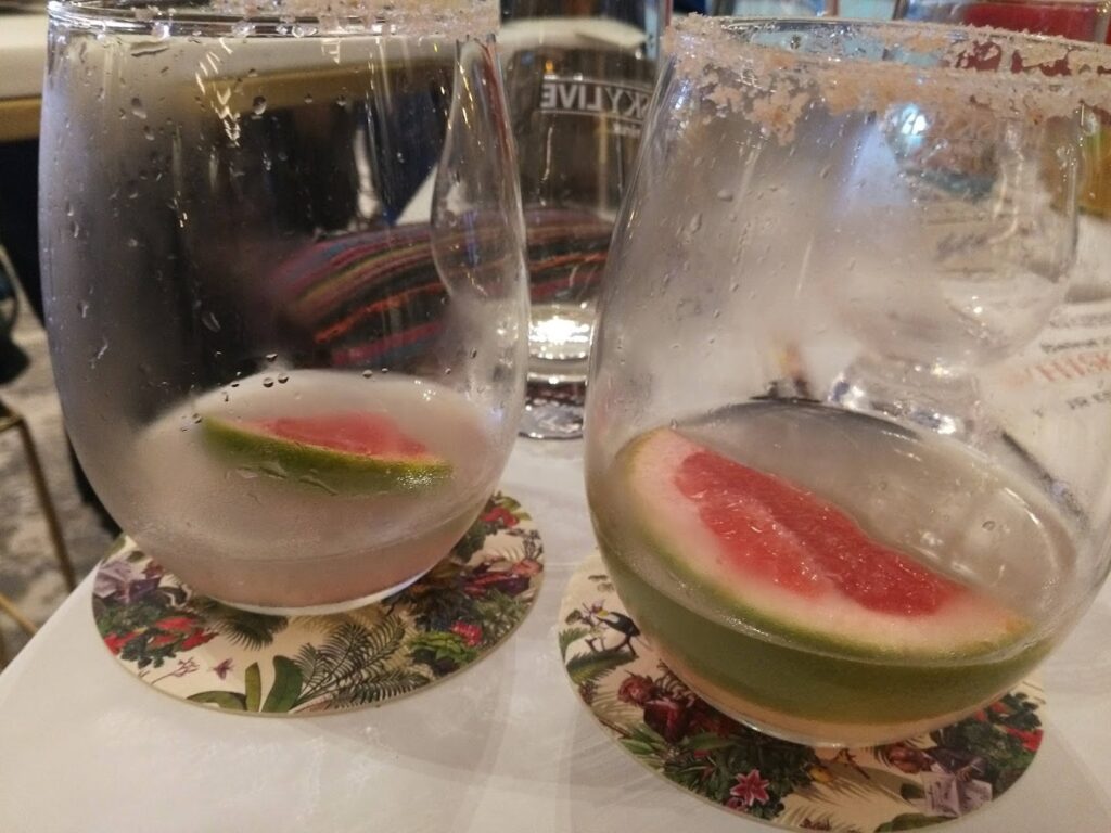 two glasses with fruit in them