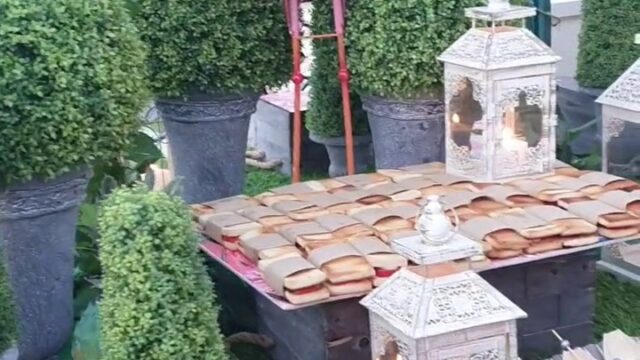 a table with food and a statue of a rooster