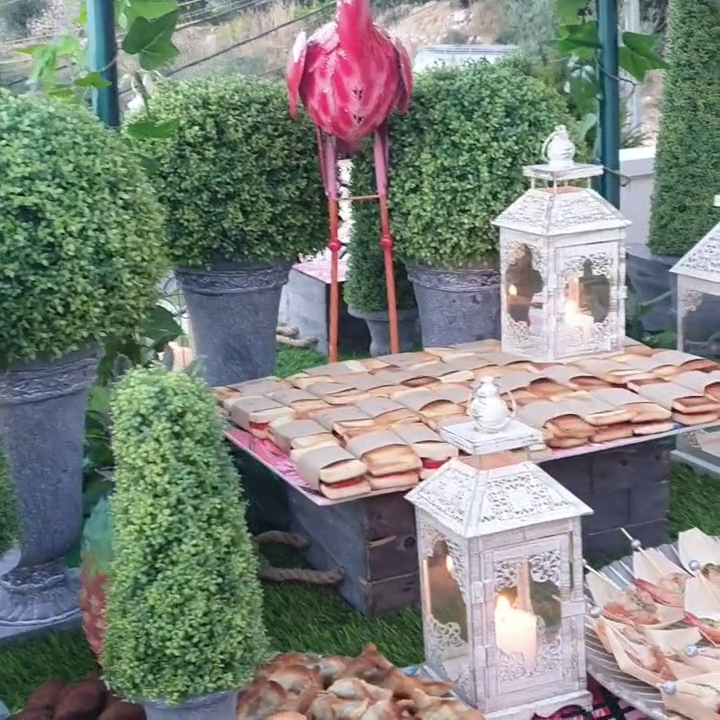 a table with food and a statue of a rooster