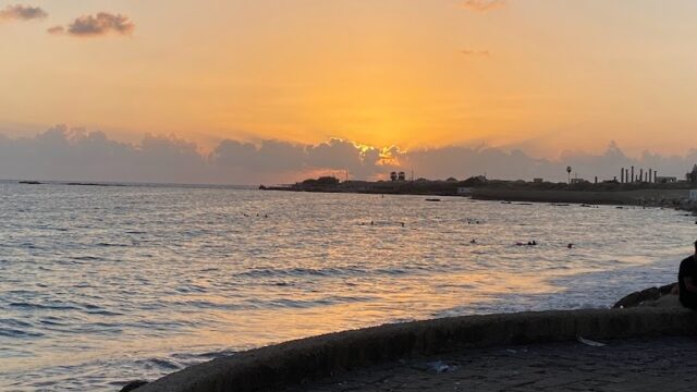 a sunset over a body of water