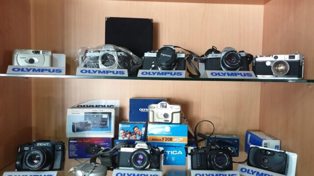 a shelf with cameras on it