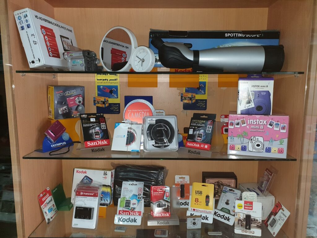 a shelf with various electronics on it