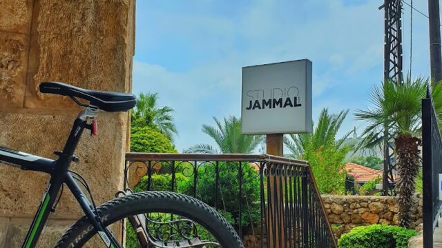 a bicycle parked on a stone walkway