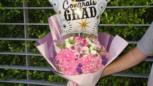 a person holding a bouquet of flowers