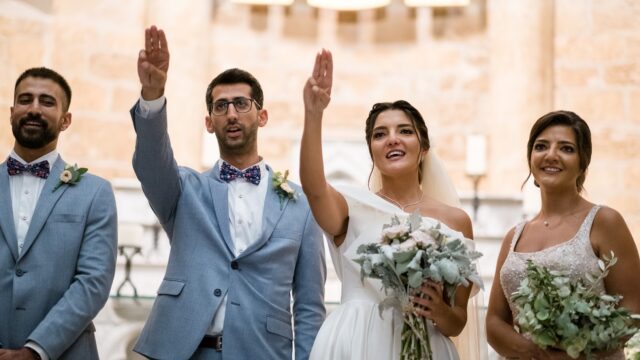 a group of people in wedding attire