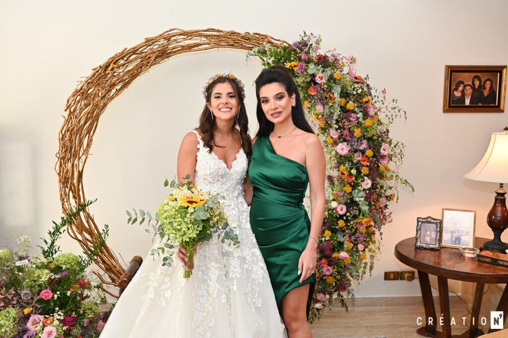 two women in dresses posing for a picture