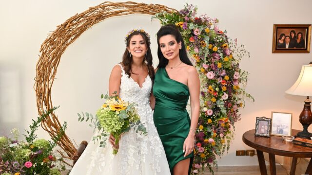 two women in dresses posing for a picture