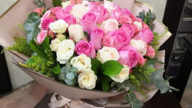 a person holding a bouquet of flowers